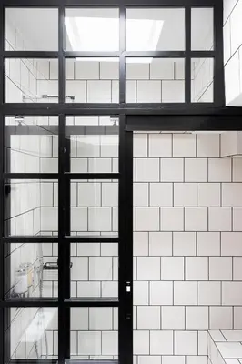 an open door in a white tiled building at Athens View Loft 07 & 08 in Athens