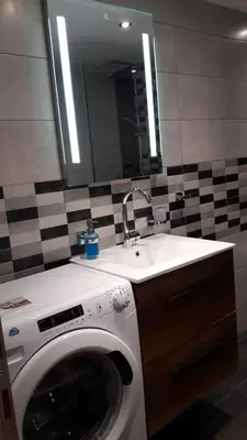 a bathroom with a washing machine and a sink at Anna's Relaxing Dreamhouse in Athens