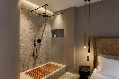 a bathroom with a shower with a glass door at *** Boutique Syntagma apartment w/ plunge pool *** in Athens