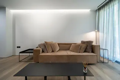 a living room with a couch and a table at The Duke Boutique Suites in Athens