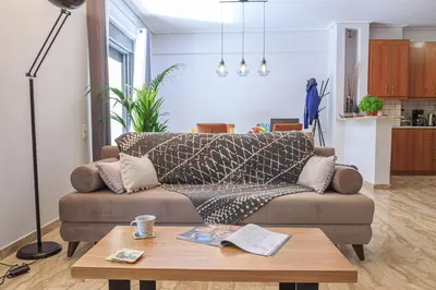a living room with a couch and a coffee table at L9 Athens in Athens