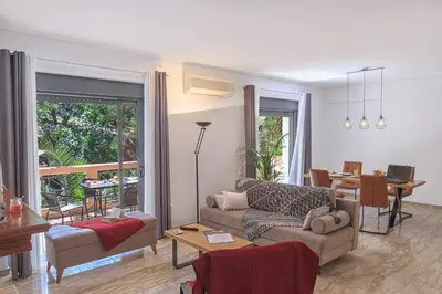 a living room with a couch and a table at L9 Athens in Athens