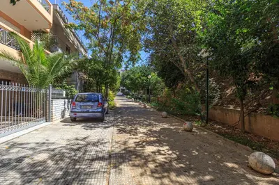 a car parked on the side of a street at L9 Athens in Athens