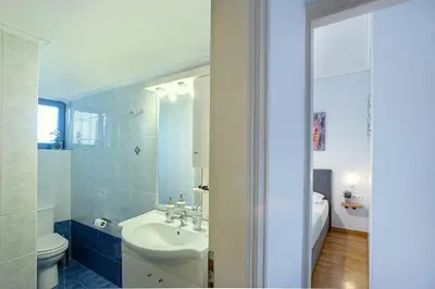 a bathroom with a sink and a toilet at L9 Athens in Athens