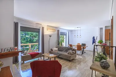 a living room with a couch and a table at L9 Athens in Athens