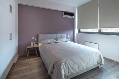 a bedroom with a large bed and a window at THE apartment 2 BDRS/2 BATHS luxury residence in Athens