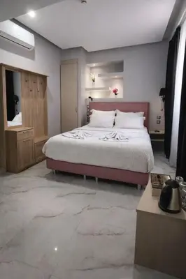 a bedroom with a large bed in a room at Athens Starlight Hotel in Athens