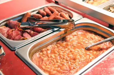 a buffet of food with beans and other foods at Athens Starlight Hotel in Athens