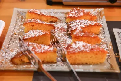 a plate of cake with powdered sugar on it at Athens Starlight Hotel in Athens