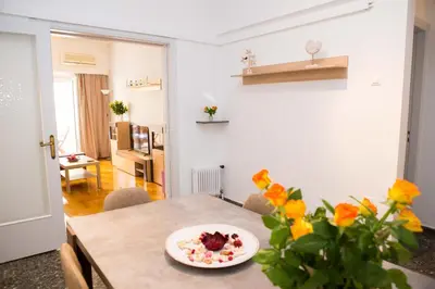 a dining room with a table with a plate of food on it at Acropolis,Historic center Apartment-update in Athens