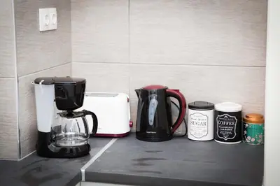 a kitchen counter with a coffee maker and a toaster at Acropolis,Historic center Apartment-update in Athens
