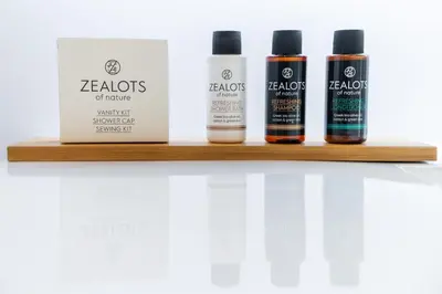 four bottles of hair products on a shelf at 33SolonosSuites in Athens