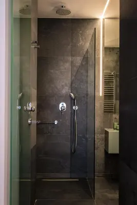 a shower with a glass door in a bathroom at PINACOTA SUITES ATHENS in Athens