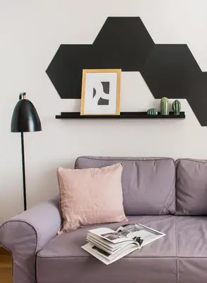 a living room with a purple couch with a black star above it at Delightful 1BD Apartment in Plaka by UPSTREET in Athens