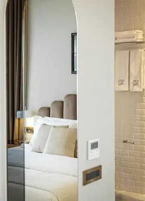 a bedroom with a bed with a glass door at Athenian Foss in Athens