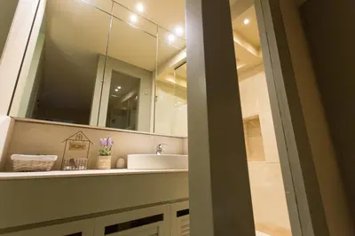 a bathroom with a sink and a mirror at Plaka360 Apartments in Athens