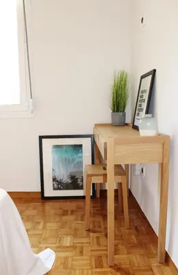 a wooden table with a plant on top of a table at Athenian Hub Luxe Loft in Athens