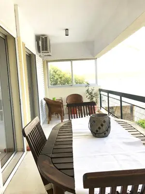 a dining table on the balcony of a house at aris sweet home 2 in Athens