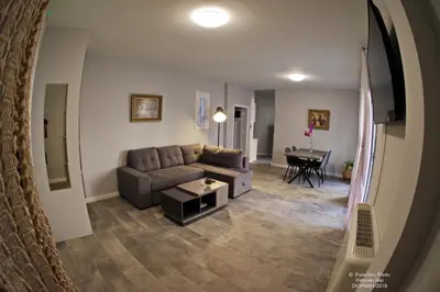 a living room with a couch and a table at Athens Historic Centre Renovated Apartments in Athens