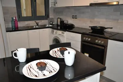 a kitchen with two plates of food on a counter at Athens Historic Centre Renovated Apartments in Athens