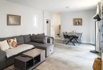 a living room with a couch and a table at Athens Historic Centre Renovated Apartments in Athens