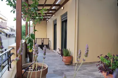 a balcony with potted plants on a building at Athens Historic Centre Renovated Apartments in Athens