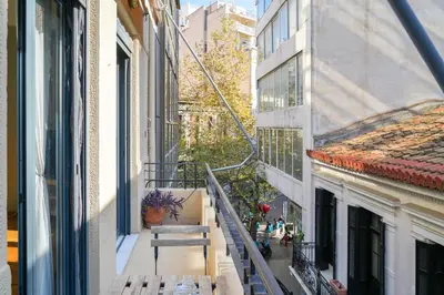 a balcony of a building with a bench on it at Athens Historic Centre Renovated Apartments in Athens
