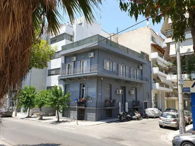 a blue building on the side of a street at Spacious 110m2 2bedrooms 2bathrooms Center Athens in Athens