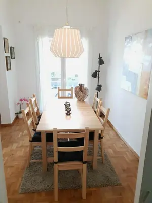 a dining room table with chairs and a pendant light at Spacious 110m2 2bedrooms 2bathrooms Center Athens in Athens