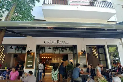 a group of people standing outside of a restaurant at Tiny Studio Suite in Athens