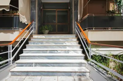 a set of stairs in front of a building at Tiny Studio Suite in Athens
