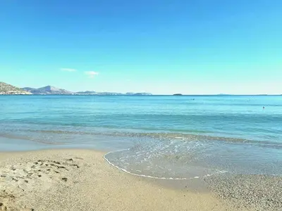 a sandy beach with the ocean in the background at Alianthos Beach Apartment in Vari