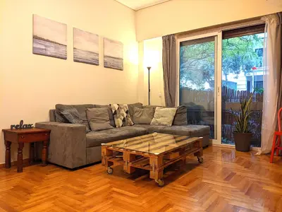 a living room with a couch and a coffee table at Acropolis in Athens