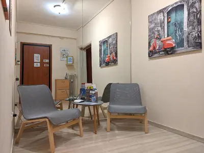 a waiting room with two chairs and a table at Acropolis in Athens