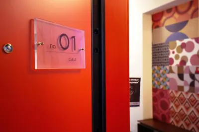a door with a no elevator sign on it at Downtown Athens Lofts by Raise in Athens