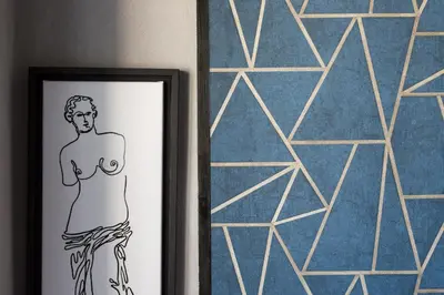 a drawing of a woman in front of a mirror at Downtown Athens Lofts by Raise in Athens