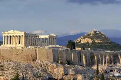 a building on a hill with a mountain in the background at Ziva Apartment - 4th floor - Renovated 2019 in Athens