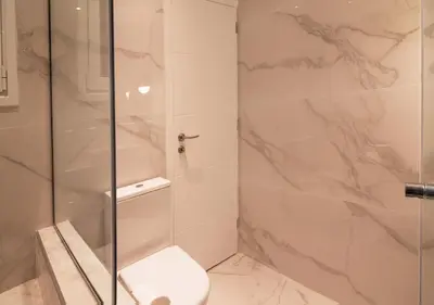 a bathroom with a shower and a toilet at Pame Rentals - Charming Central Studio in Athens