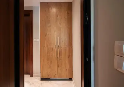 a wooden door in a room with a bathroom at Pame Rentals - Charming Central Studio in Athens