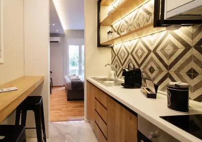 a kitchen with a sink and a counter at Pame Rentals - Charming Central Studio in Athens