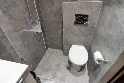 a bathroom with a toilet and a shower at Classy and stylish apartment next to Hilton in Athens