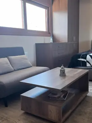 a living room with a coffee table and a couch at Calmness Near the City in Metókhi
