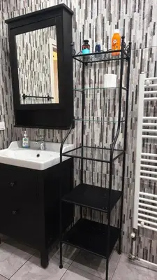 a bathroom with a sink and a mirror at 133 Sokratous, Black marble. in Athens