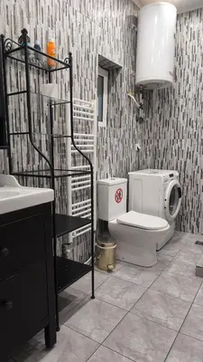a bathroom with a toilet and a sink at 133 Sokratous, Black marble. in Athens