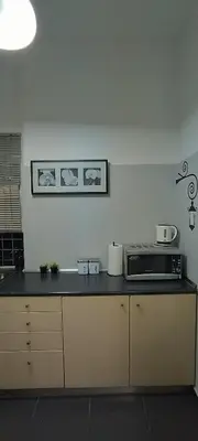 a kitchen with a counter top with a microwave at Modern flat in city center in Athens