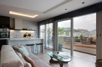 a living room with a couch and a glass table at Supreme Luxury Suites by Athens Stay in Athens