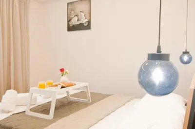 a room with a table and a blue vase at Home pleasure project in Athens