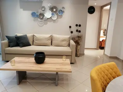 a living room with a couch and a coffee table at Home pleasure project in Athens