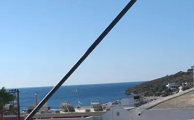 a view of the ocean from a bridge at agia marina riviera aigina in Agia Marina Aegina
