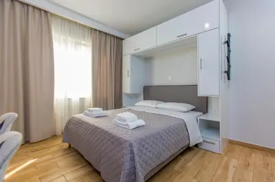 a bedroom with a bed with towels on it at Athens Raise Acropolis Project in Athens